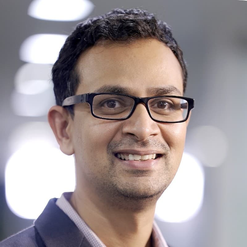 A professional headshot of Sandeep Lakhanpal, Managing Director at I Squared Capital